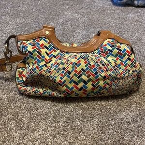 Cole Haan multi-color purse with leather braided handles.